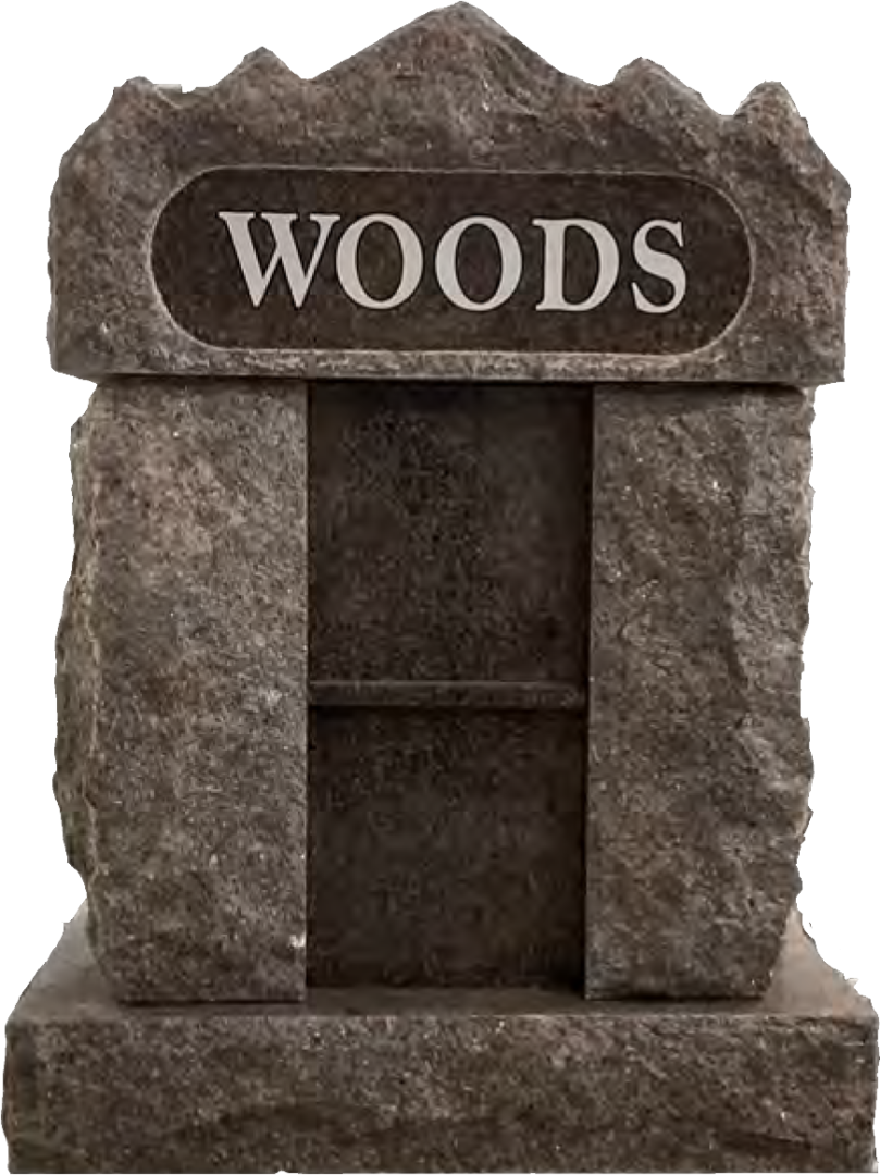 A stone grave marker with the word woods on it.