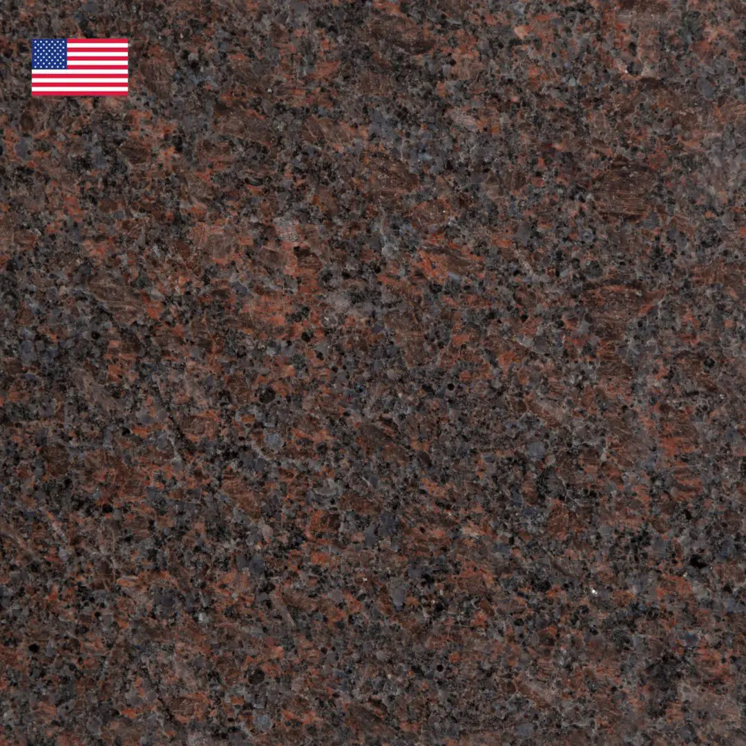 A close up of the granite surface with an american flag on it.