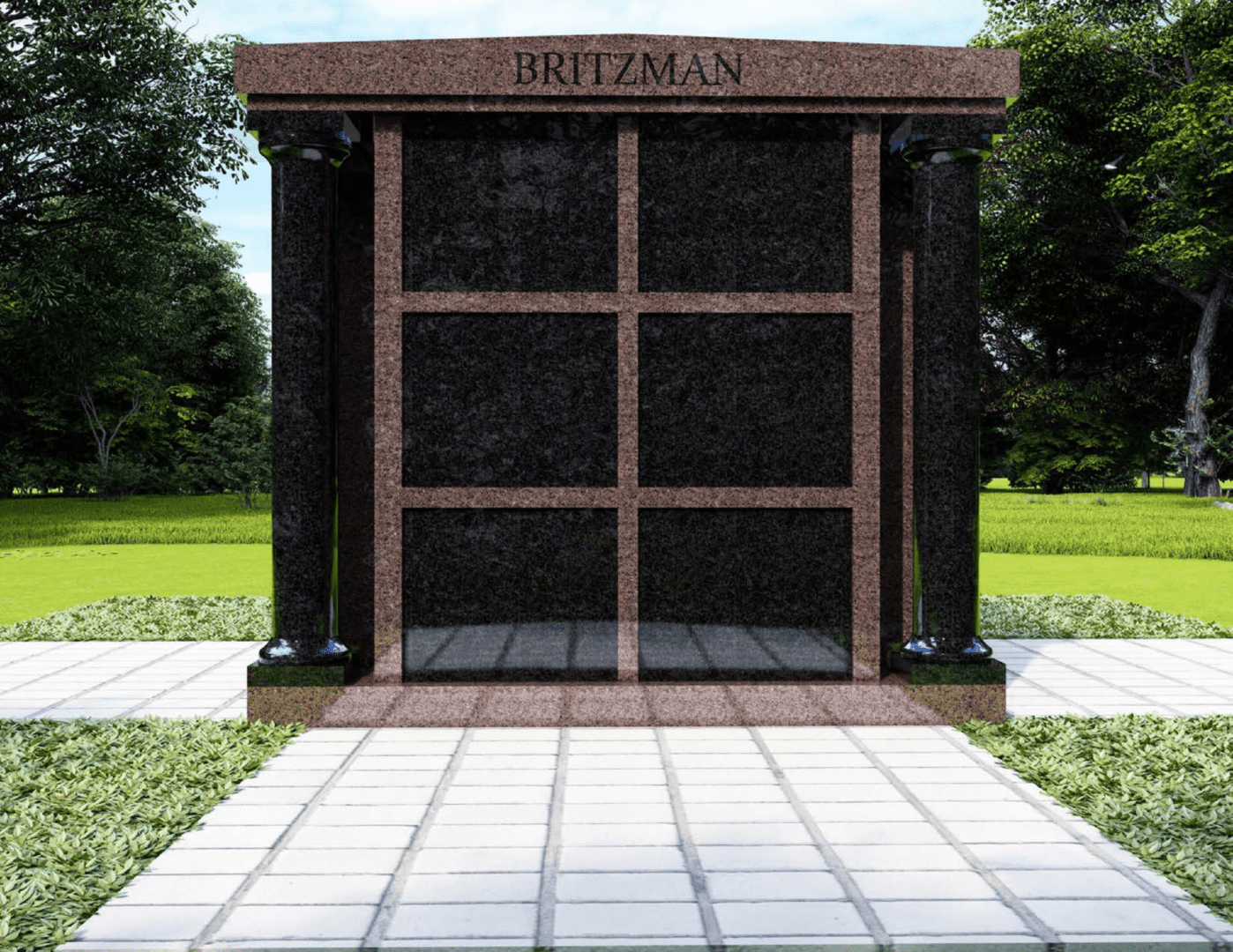 A stone memorial with pillars and a name plate.