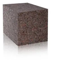 A block of brown granite on a white surface.