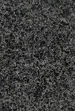 A black granite stone surface with some small spots.