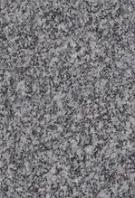 A gray granite surface with many small spots.