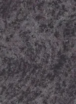A black granite surface with some white spots