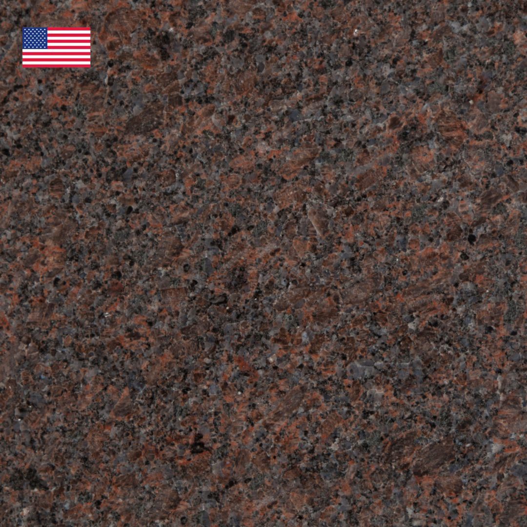 A close up of the granite surface with an american flag on it.