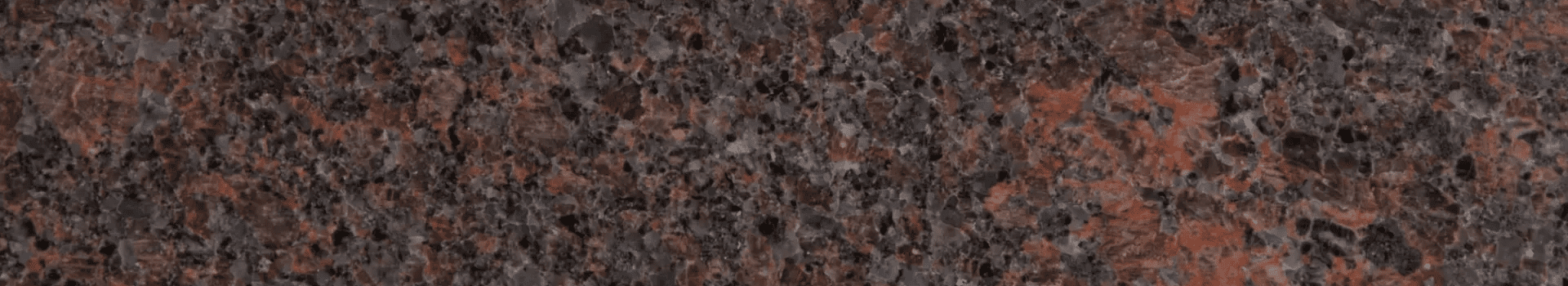 A brown and black marble background with some small spots.