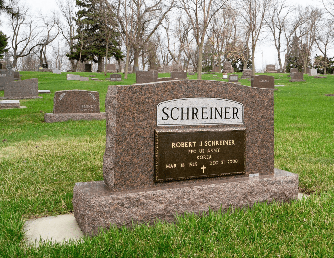 A grave yard with many different types of headstones.