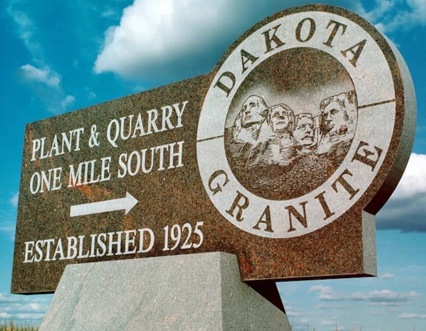 A sign for the dakota granite plant and quarry.