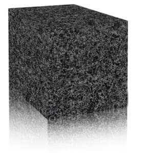 A black granite block with reflection on the ground.